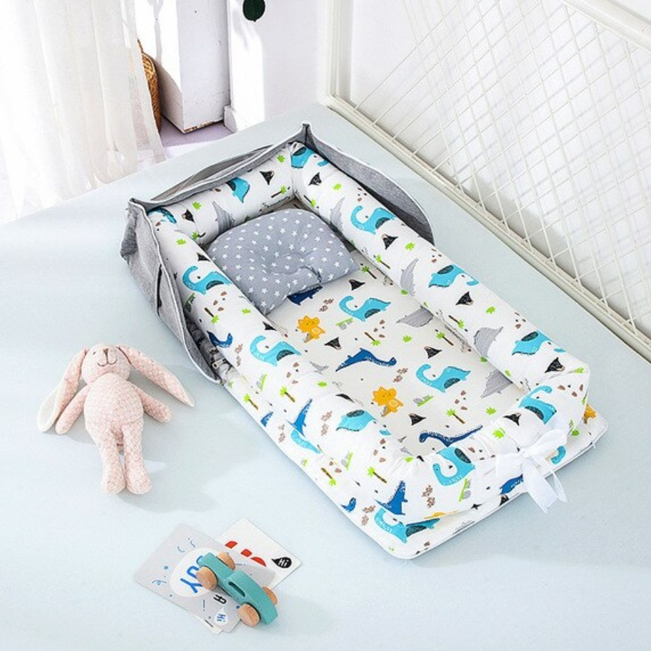 Portable und faltbare Babybett mit Kissen