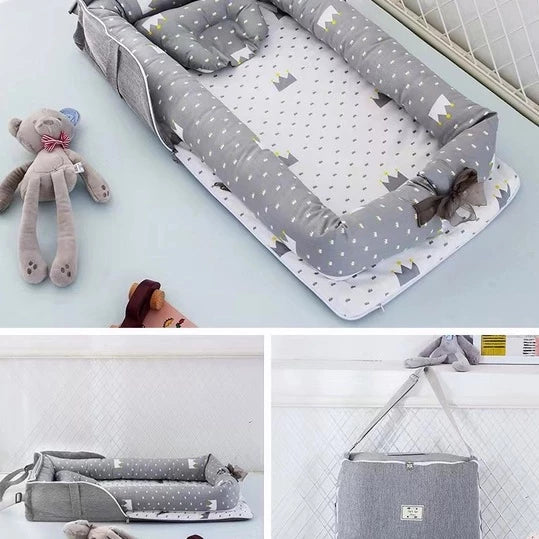Portable und faltbare Babybett mit Kissen